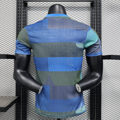 Blue and green striped Real Madrid 25/26 player training polo shirt